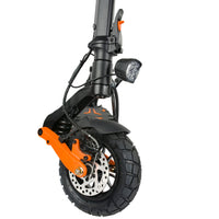 Side close-up of KuKirin G2 Pro front wheel assembly, 9-inch inflatable off-road tire, front spring shock absorber, disc brake, bright LED headlight and orange alloy swingarm for foldable electric scooter