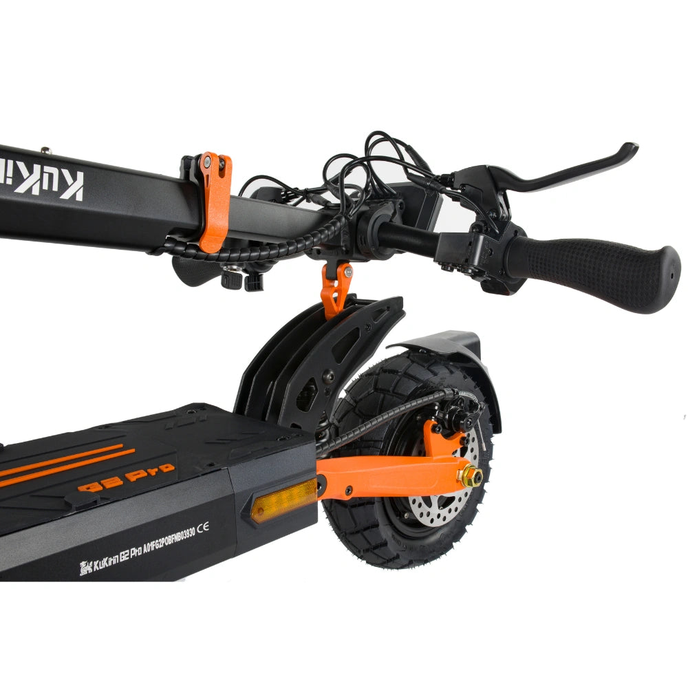Close-up of KuKirin G2 Pro electric scooter folding lock, rear dual disc brake, 9-inch off-road tire and orange alloy suspension arm