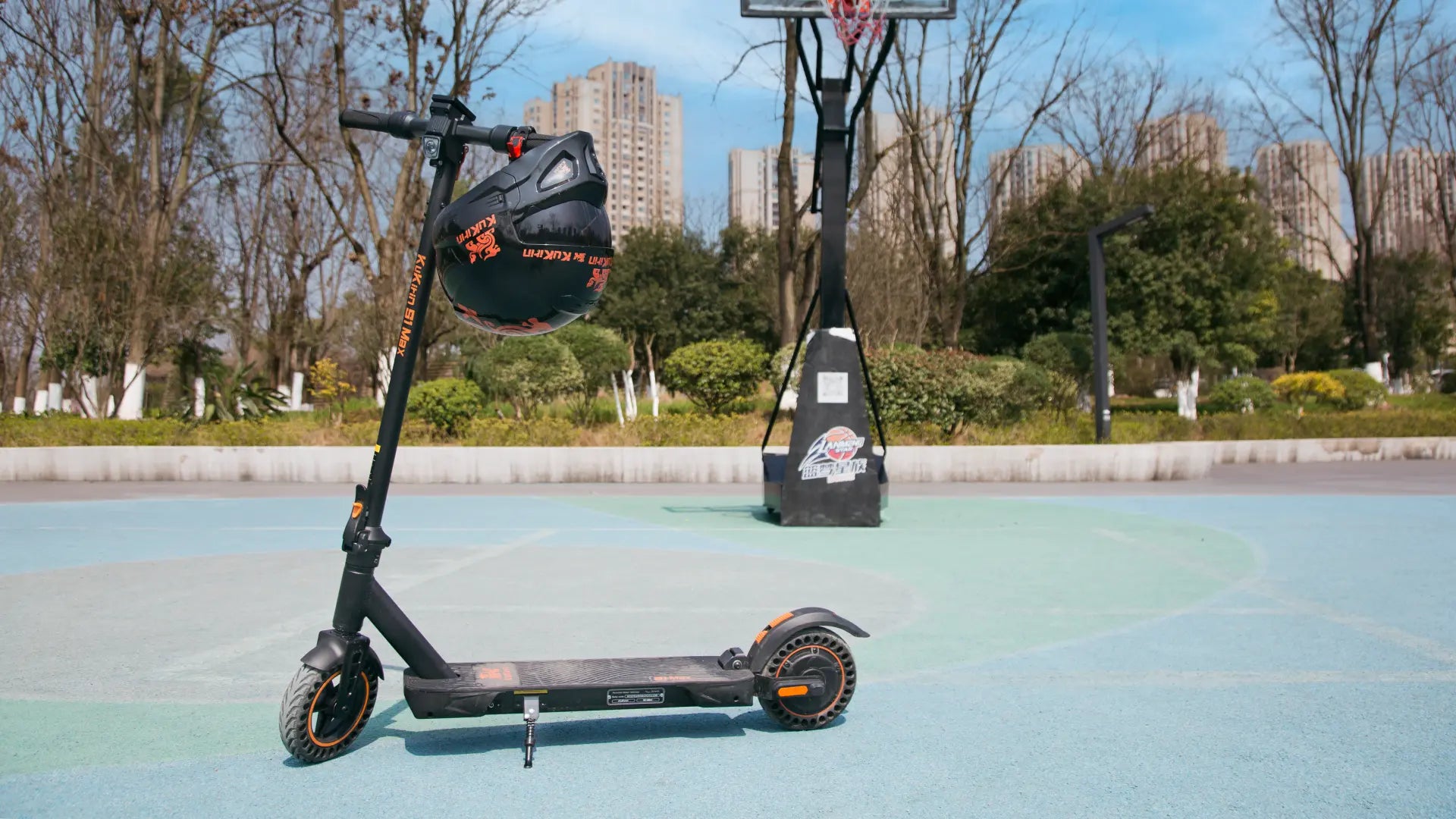 KuKirin S1 Max electric scooter with 350W motor and honeycomb tires displayed in an urban recreational setting, suitable for city commuting and leisure riding.